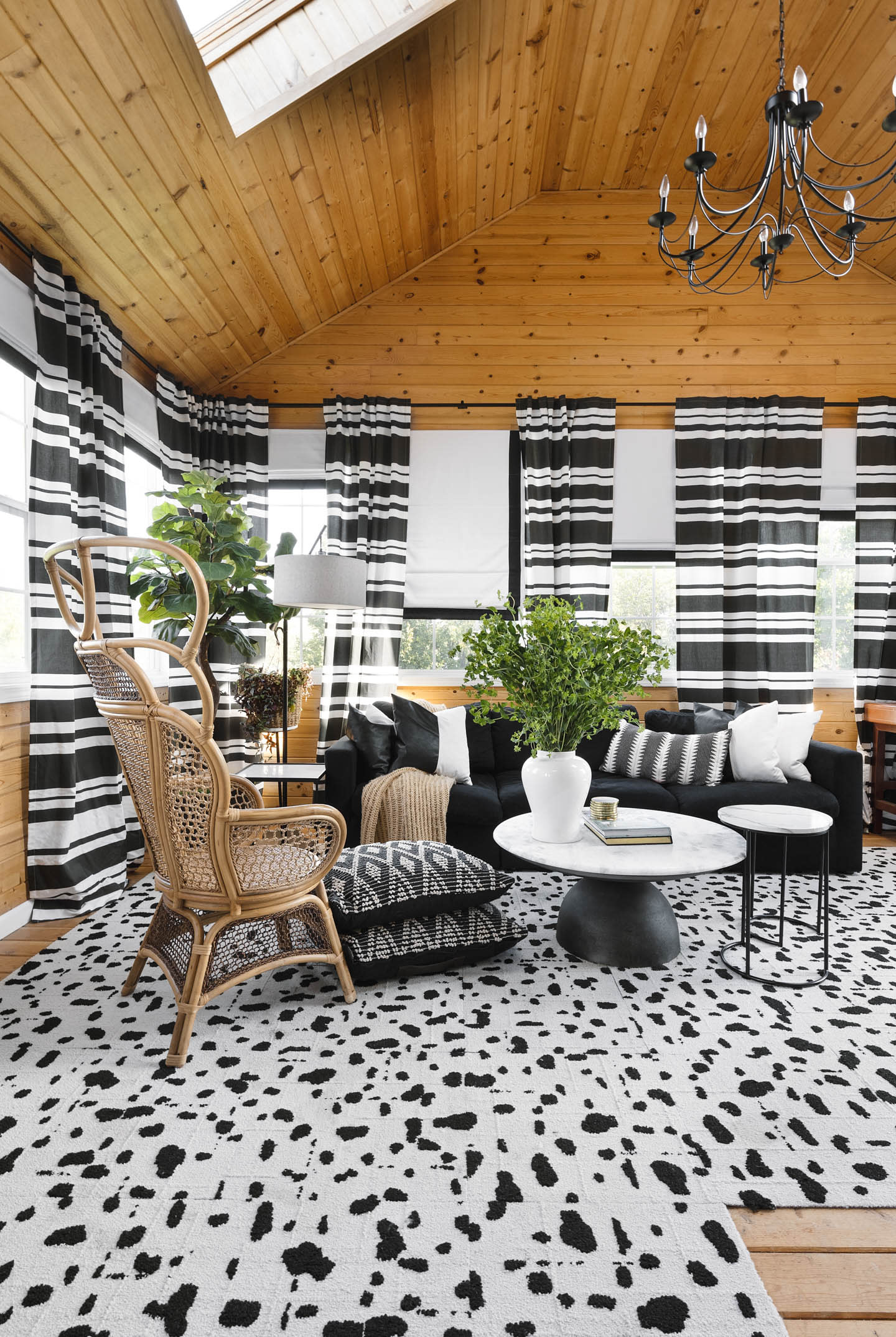 modern black and white flooring in a living room with striped black and white curtains