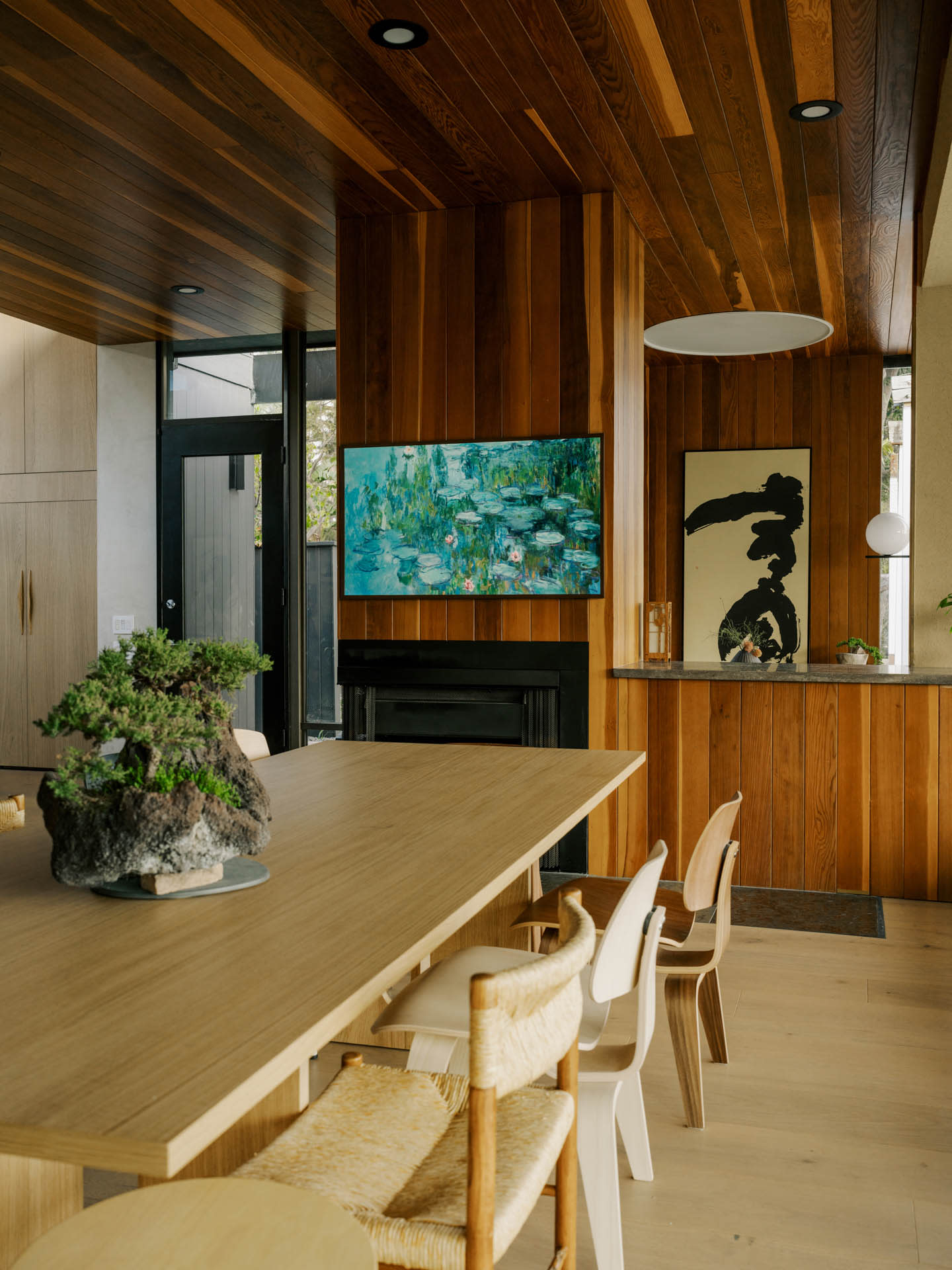 modernist dining room with a redwood ceiling and wall