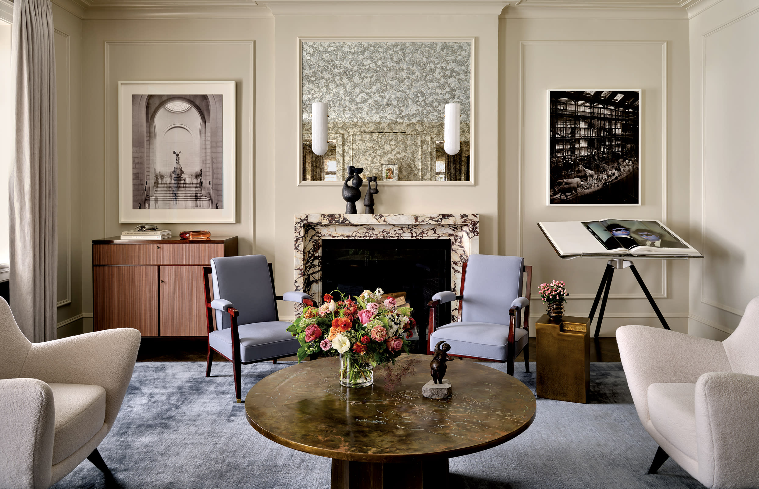 contemporary living room with a purple-accented stone fireplace and a blue-gray rug