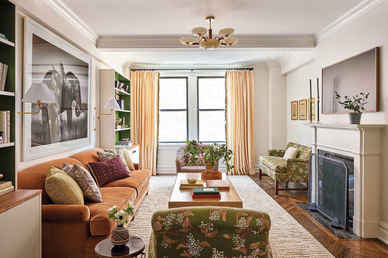 traditional living room with an orange sofa and green settee